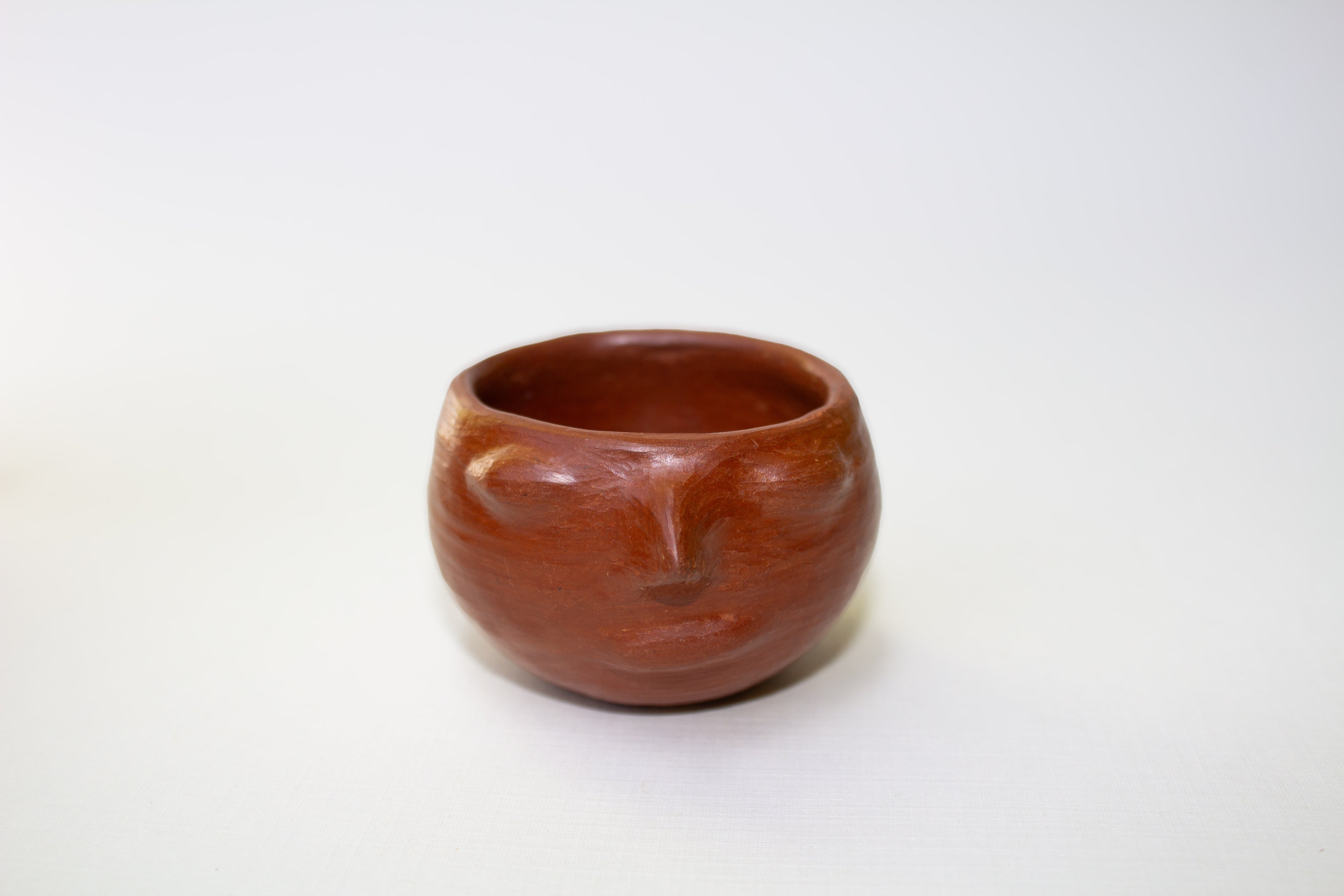 Juego de mezcalero con cara de barro rojo