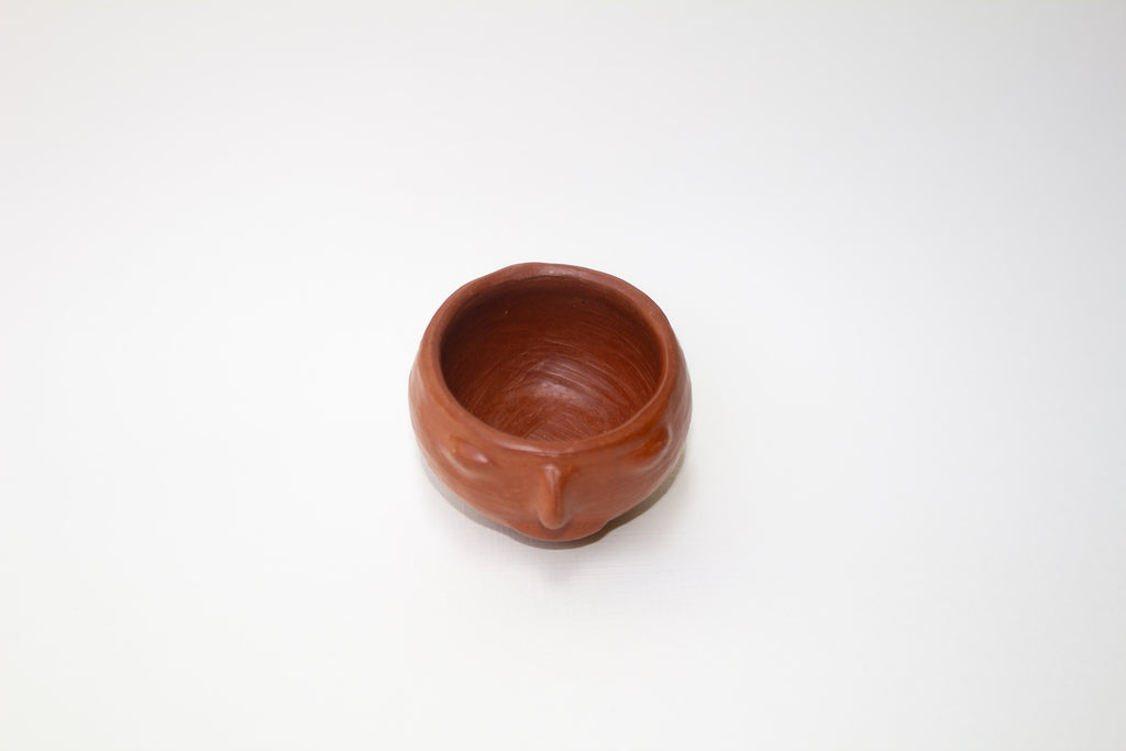 Juego de mezcalero con cara de barro rojo