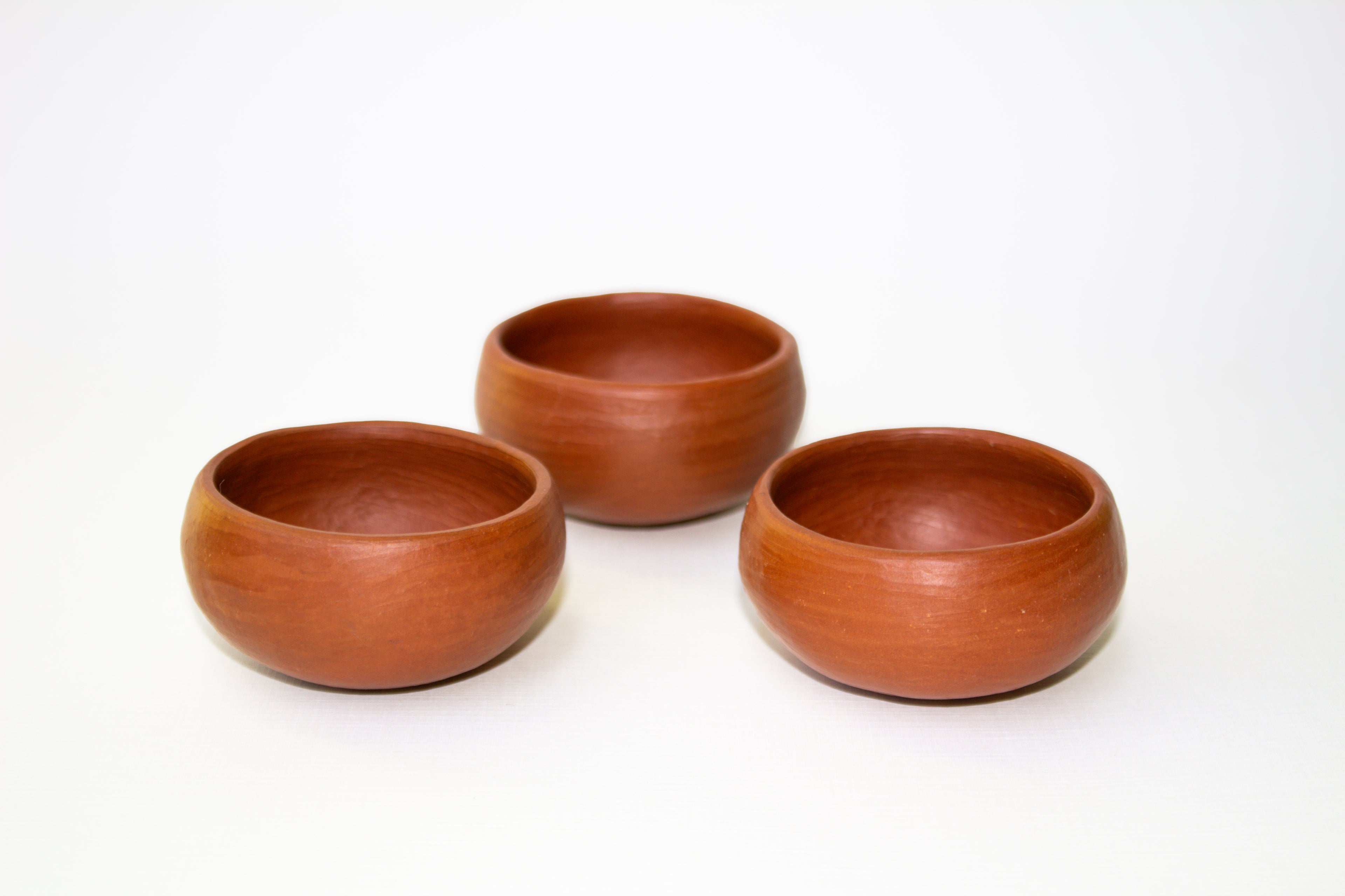 Juego de mezcaleros redondos de barro rojo