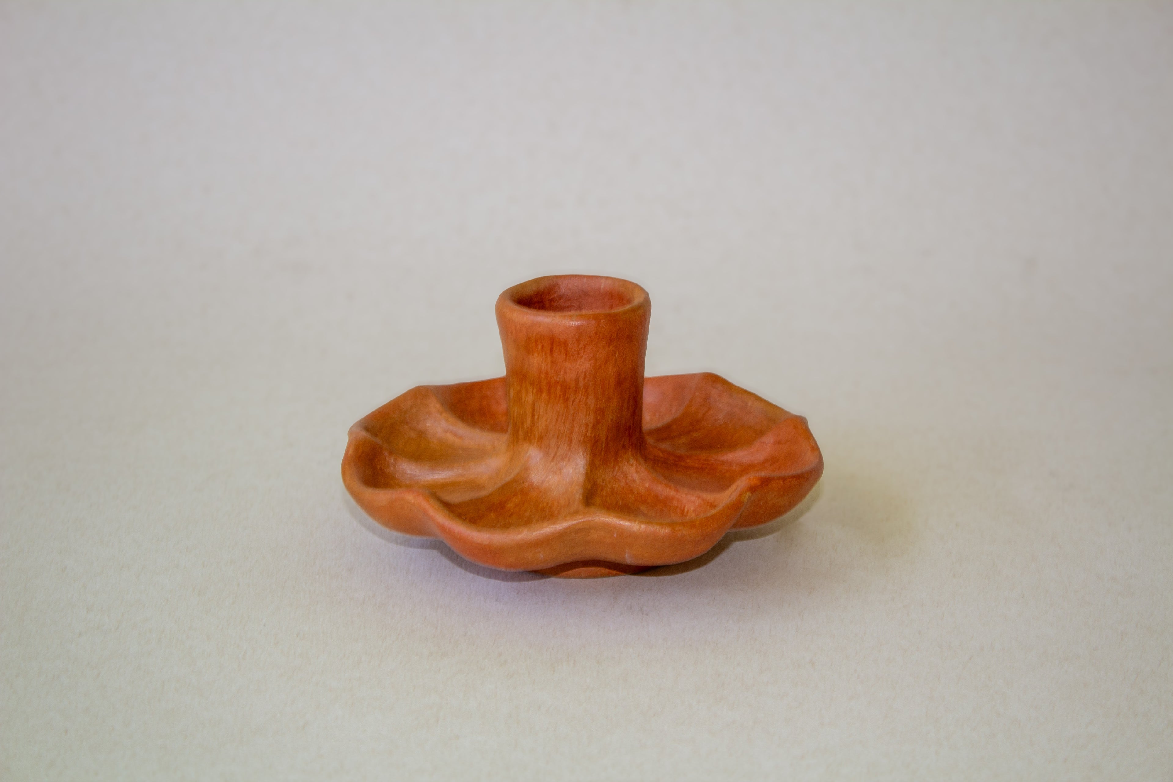 Candelabro flor barro naranja