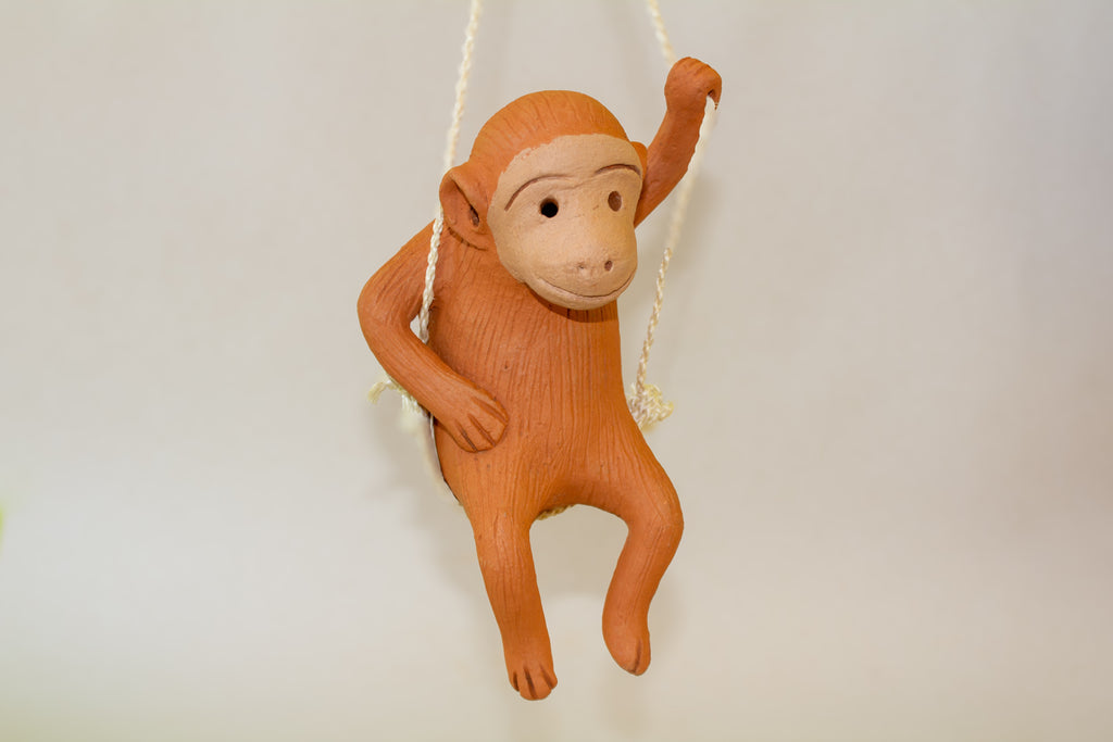 Chango colgante columpio de barro naranja